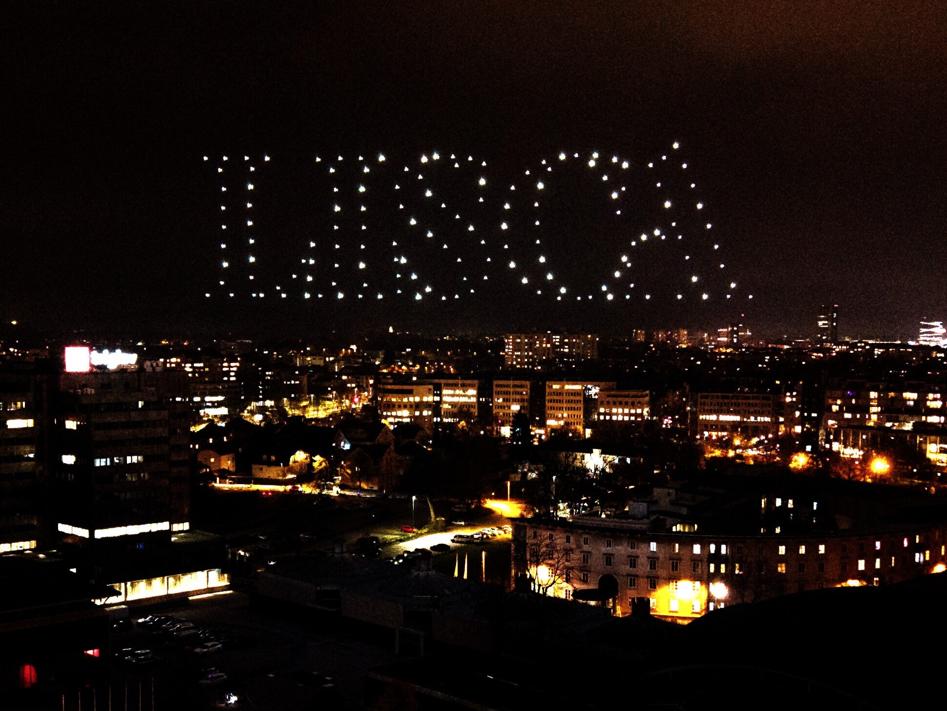 Skydance Drone Light Shows Ljubljana LISCA text drone formation above city skyline at night
