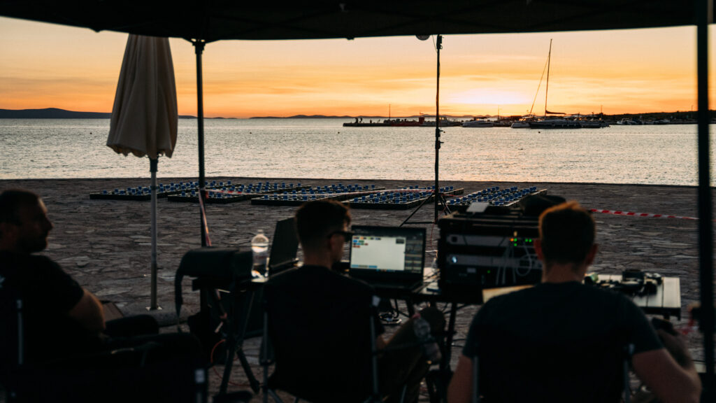 Skydance Drone Light Shows pilot monitoring drone system on laptop during operation