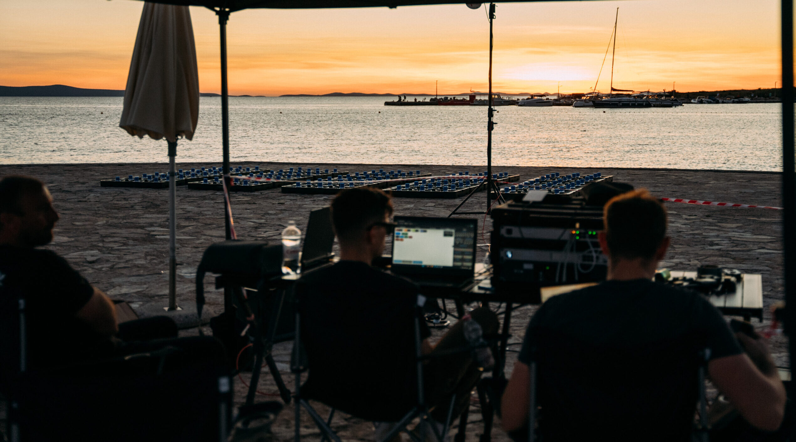 Skydance Drone Light Shows technician operating drone control system with laptop during setup