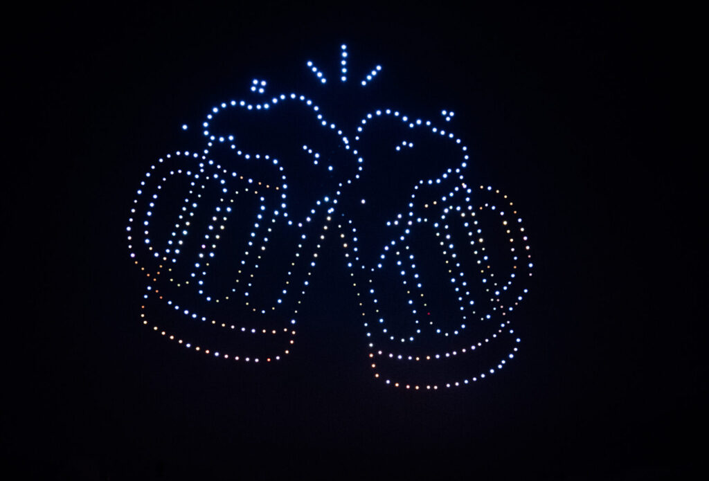 Skydance Drone Light Shows beer mugs drone formation with clinking cheers lights in night sky