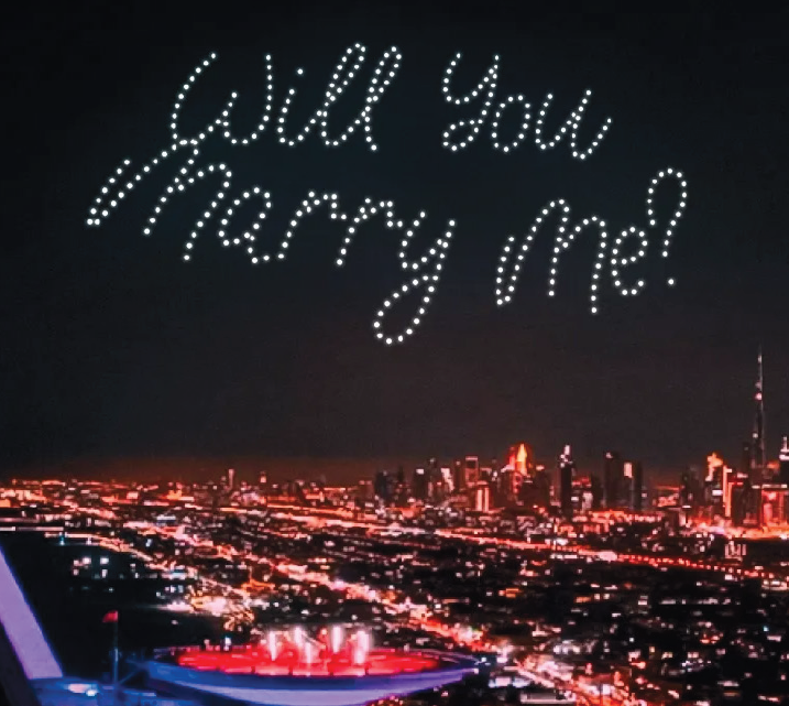 Skydance Drone Light Shows will you marry me drone message above city skyline at night
