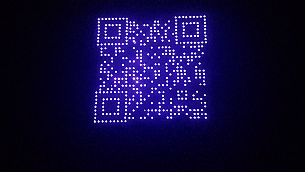 Skydance Drone Light Shows glowing QR code made of drone lights on blue background